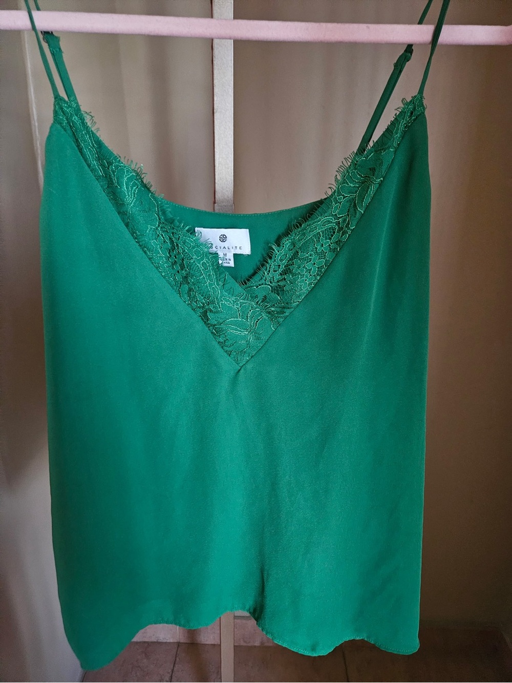 Socialite emerald green camisole features delicate lace trim on  the V-neckline
